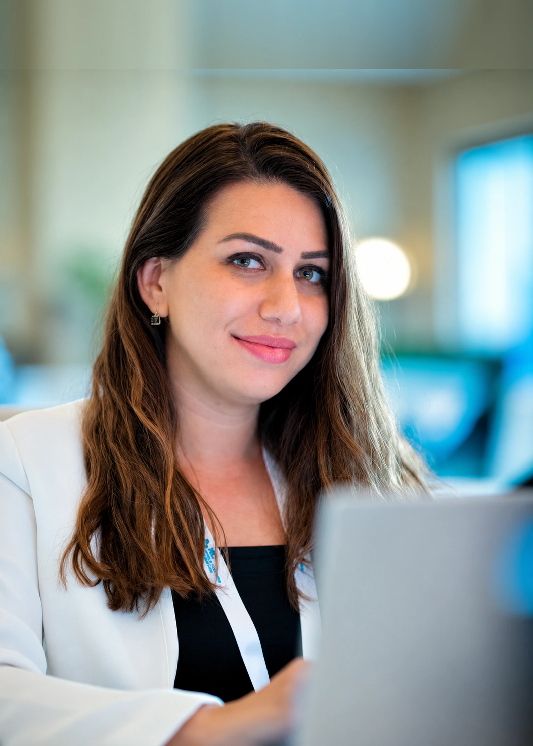 Joumana Saad writing at her desk