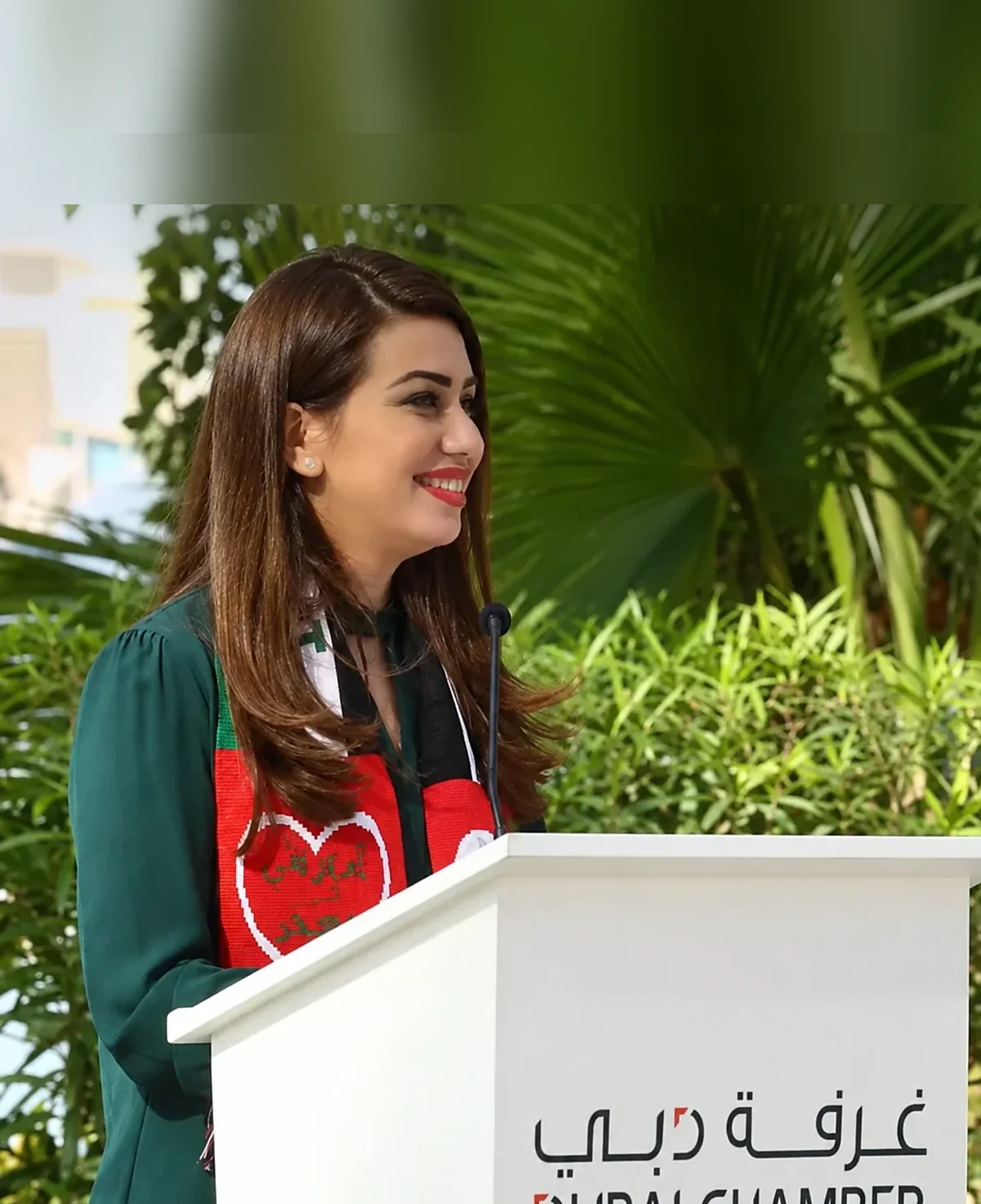 Joumana Saad speaking at a Dubai Chamber podium
