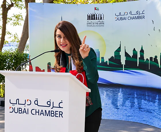 Joumana Saad speaking at a Dubai Chamber podium